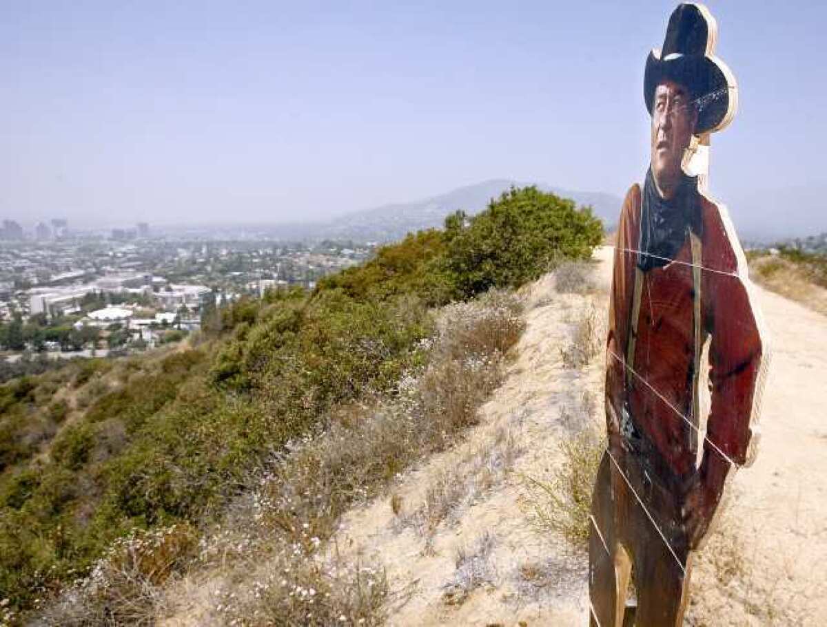 A cutout of John Wayne was placed at the top of the hills northeast of the 2 and 134 Freeways overlooking Glendale to the Southwest.