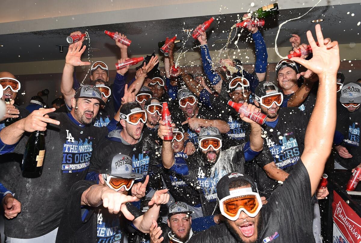 The Dodgers celebrate after clinching the NL West.