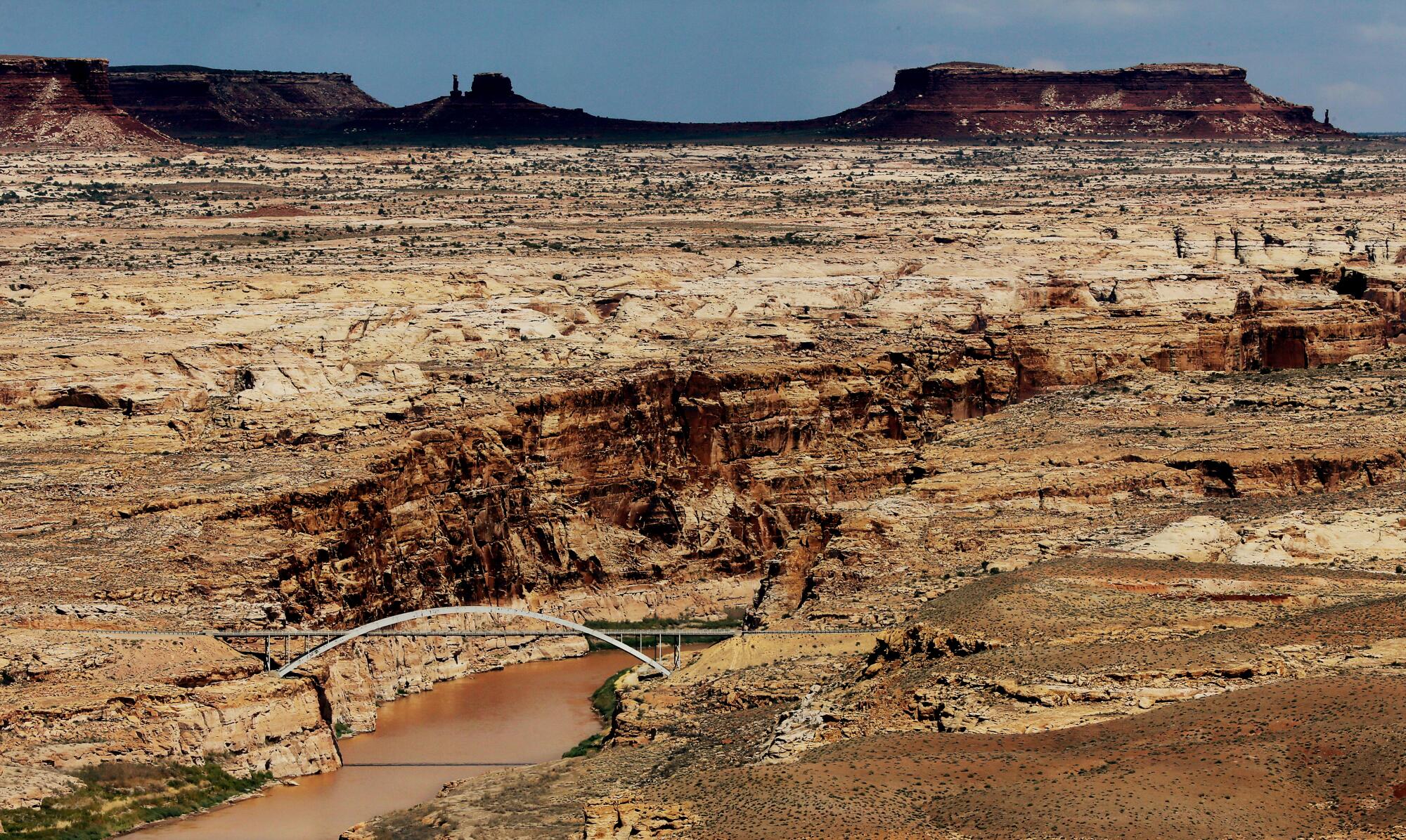 The Hite Crossing Bridge spans the Colorado River in southern Utah near its confluence with the Dirty Devil River. 