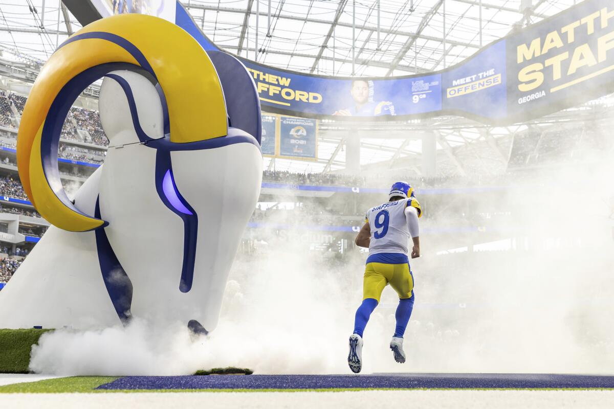 Rams quarterback Matthew Stafford runs onto the field before a loss to the Dallas Cowboys at SoFi Stadium.