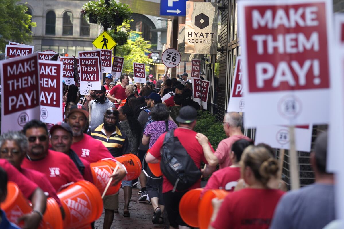 Union members from Local 26 picket outside the Hyatt Regency Boston.