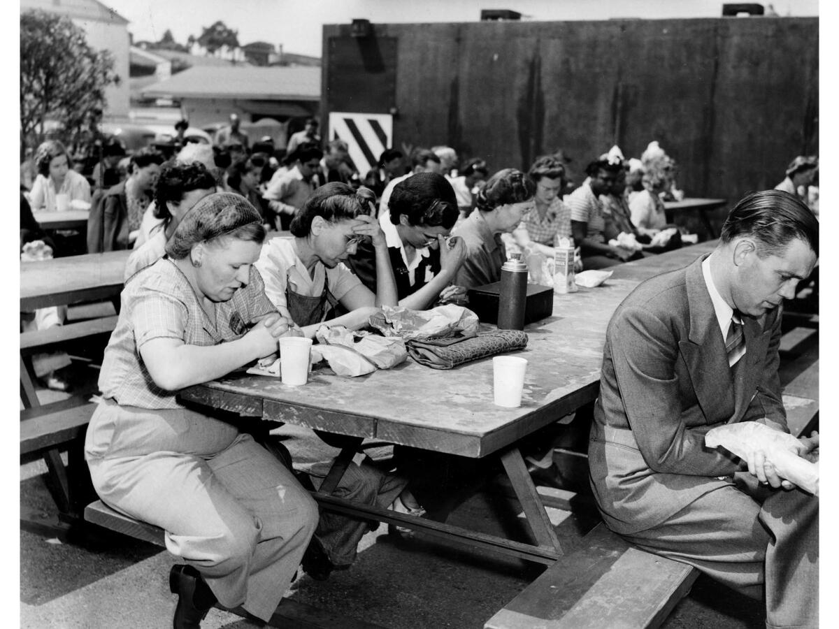 June 6, 1944: Douglas Aircraft Co. workers bow in silent prayer during lunch break as the D-day invasion continued in France..