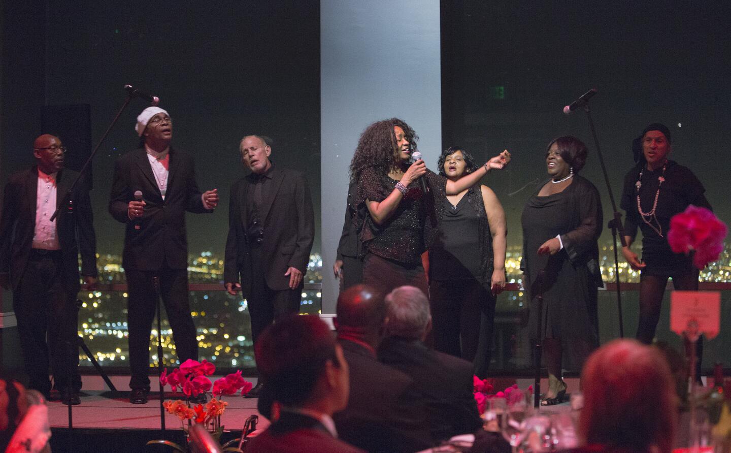 A choir made up of singers from skid row performs during a gala at the City Club in Los Angeles.