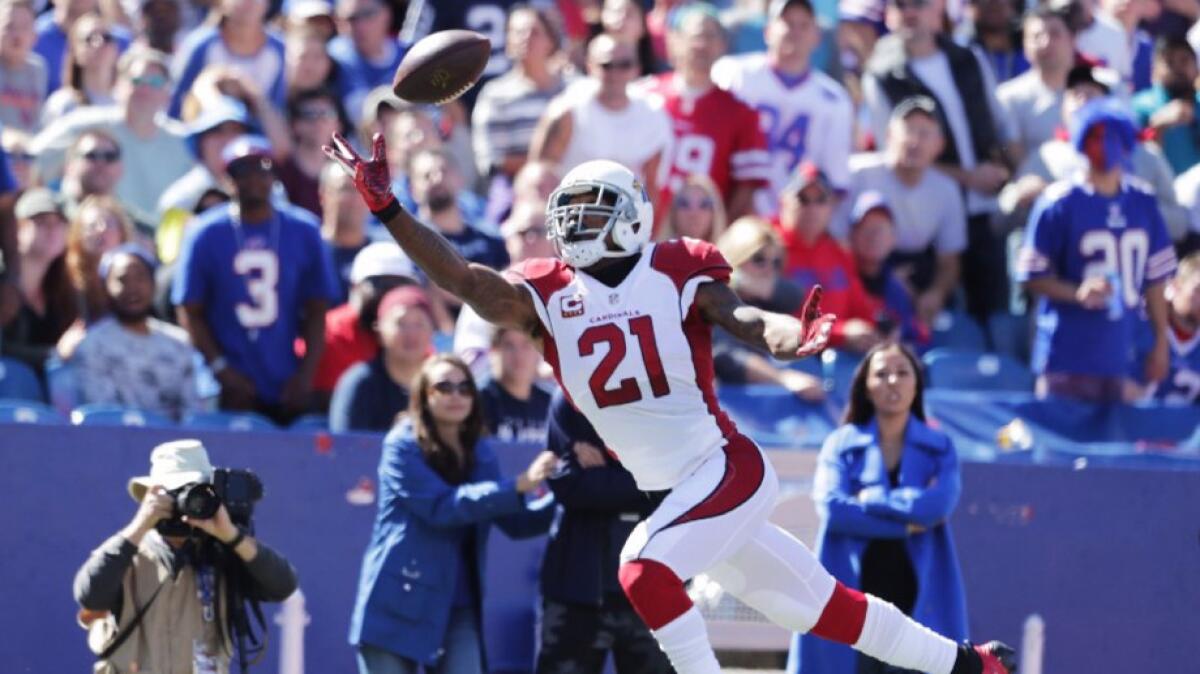 Cardinals cornerback Patrick Peterson reaches out to make a one-handed interception of Bills quarterback Tyrod Taylor during a game on Sept. 25.