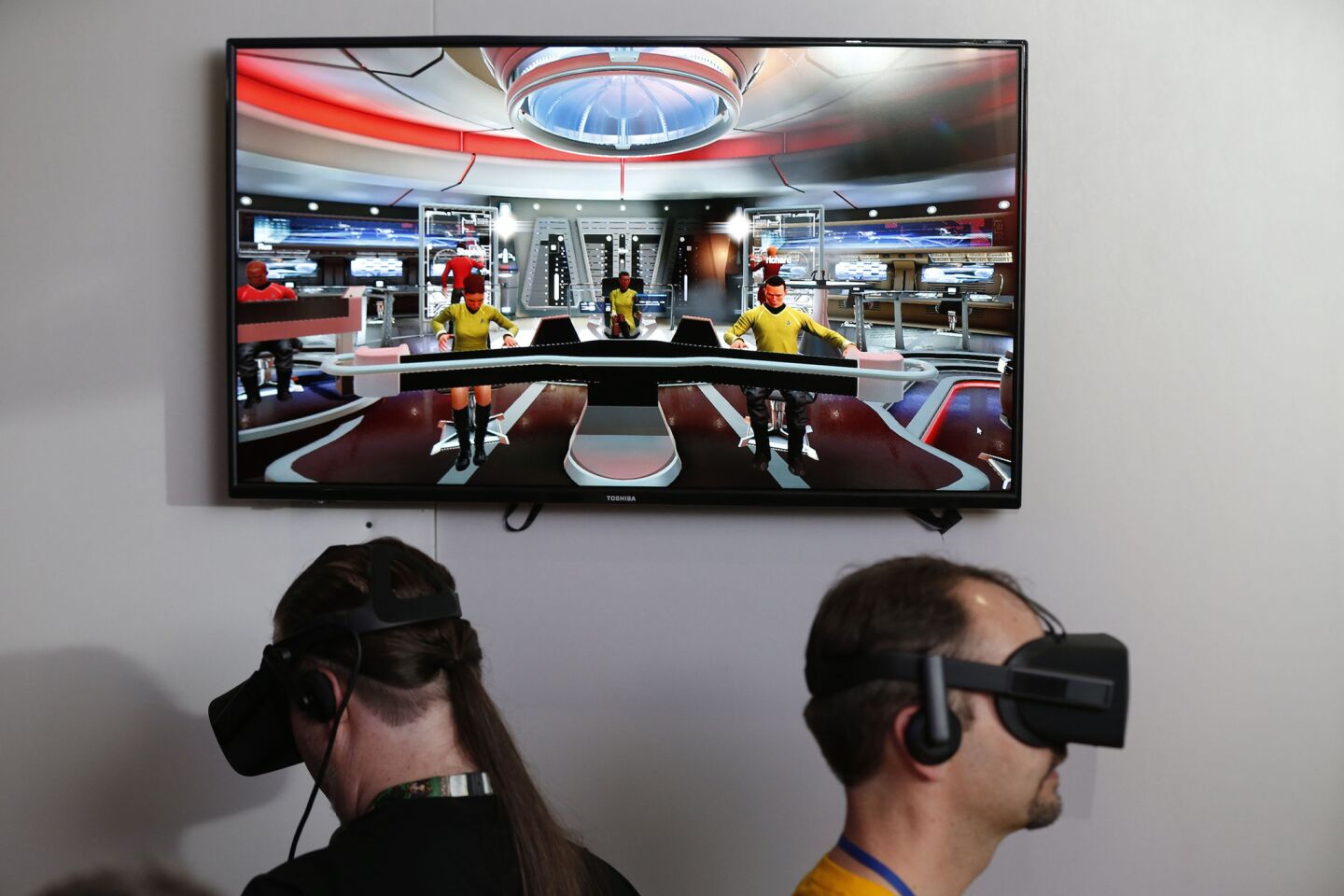 Rus Mclaughlin, left, and Brian Tate play Ubisoft's "Star Trek Bridge Crew" VR video game using the Oculus Rift VR and Oculus touch hand trackers during the Electronic Entertainment Expo.