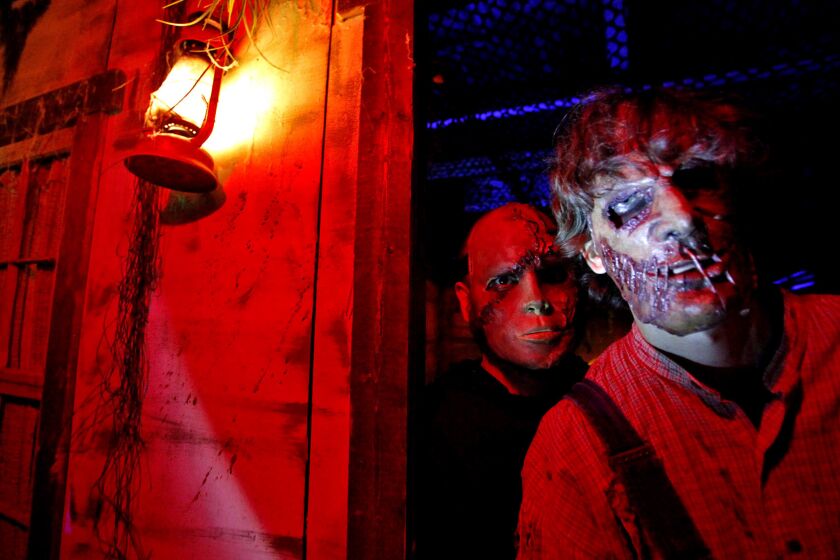 Robert Alexander, left, and Aaron Silvey are two of the frightening characters that can be found in the shadows of the Reign of Terror Haunted House.