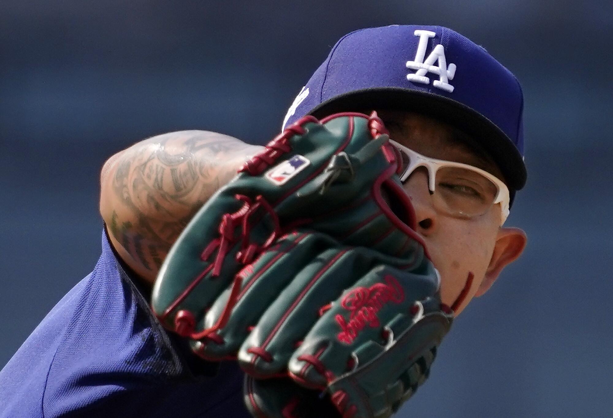 A closeup shot of Dodgers starting pitcher Julio Urías as he pitches against the San Francisco Giants