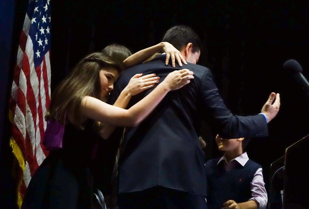 Marco Rubio is consoled by his family after he dropped out of the Republican race for president.