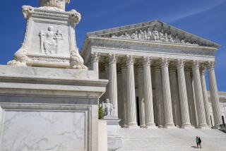 FILE - The Supreme Court is seen, with a carving of Justice in the foreground, April 19, 2023, in Washington. 