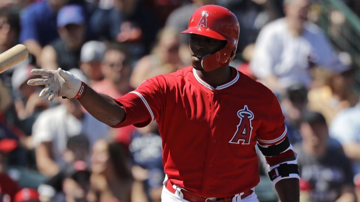 Angels outfielder Justin Upton tosses his bat after being walked during an exhibition game against the Chicago White Sox in March. A sprained toe has prevented Upton from playing this season.