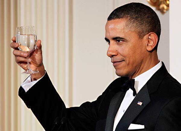 President Obama offers a toast as he and First Lady Michelle Obama hosts a state dinner for Chinese President Hu Jintao at the White House. Story: Obamas host 'quintessentially American' dinner for Hu Jintao