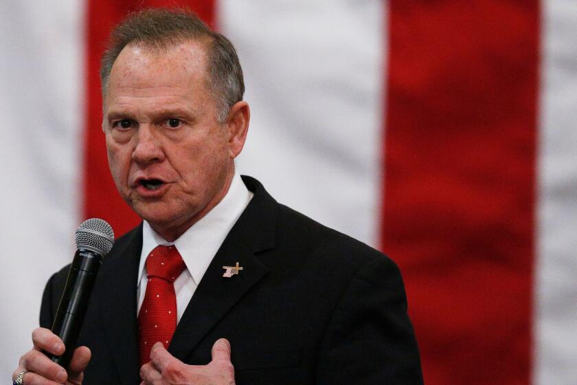 FILE- In this Dec. 11, 2017, file photo, U.S. Senate candidate Roy Moore speaks at a campaign rally in Midland City, Ala. Moore is going to court to try to stop Alabama from certifying Democrat Doug Jones as the winner of the U.S. Senate race. Moore filed a lawsuit Wednesday evening, Dec. 27, 2017, in Montgomery Circuit Court. (AP Photo/Brynn Anderson, File)