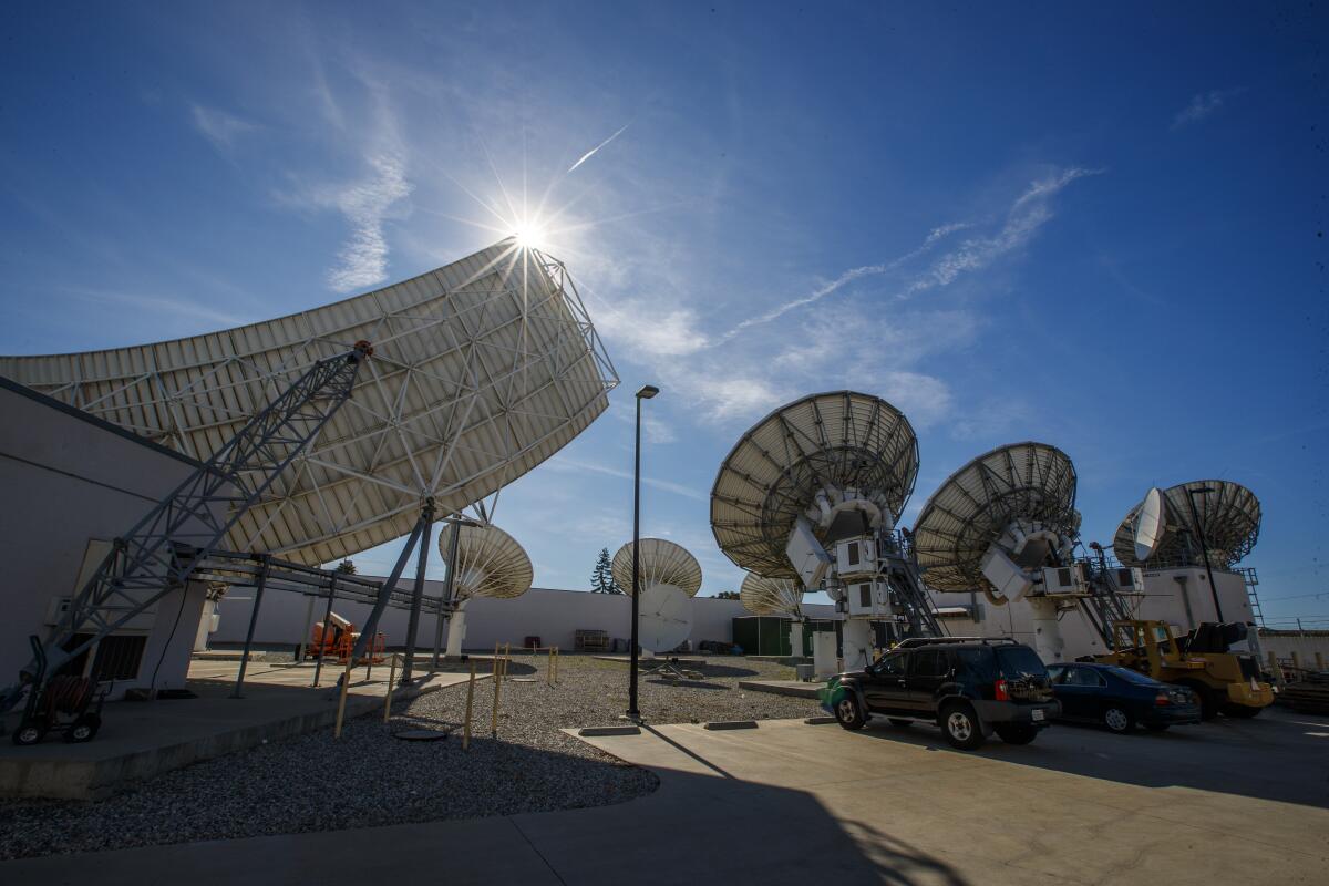 A view of DirecTV satellite dishes pointed toward the sky