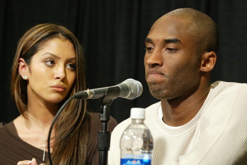 Kobe Bryant, with his wife, Vanessa, at his side, holds a news conference at Staples Center to discuss accusations by a 19-year-old Colorado woman that he sexually assaulted her. He conceded he was guilty of adultery, but he declared he was innocent of charges of felonious sexual assault.