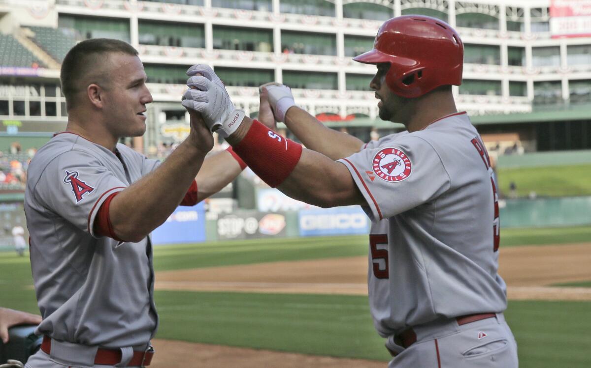 Angels outfielder Mike Trout, left, and first baseman Albert Pujols, right, are both headed to the MLB All-Star game in Cincinnati.