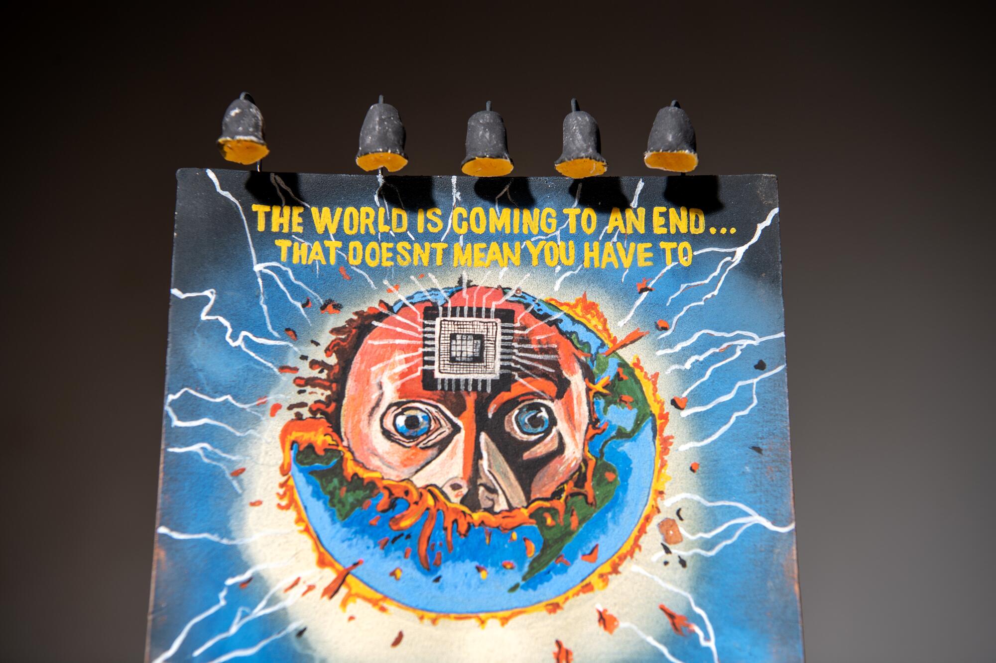 A ceramic billboard advertising "The World Is Coming to an End."