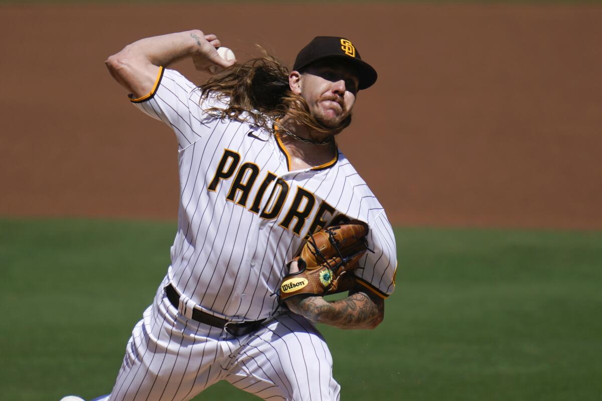 San Diego Padres starting pitcher Mike Clevinger works against an Angels batter.