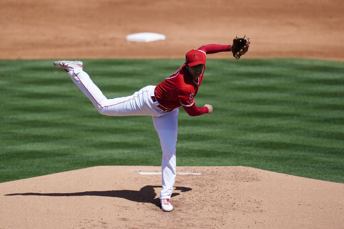 Angels pitcher Shohei Ohtani works during a spring training game against the Kansas City Royals.
