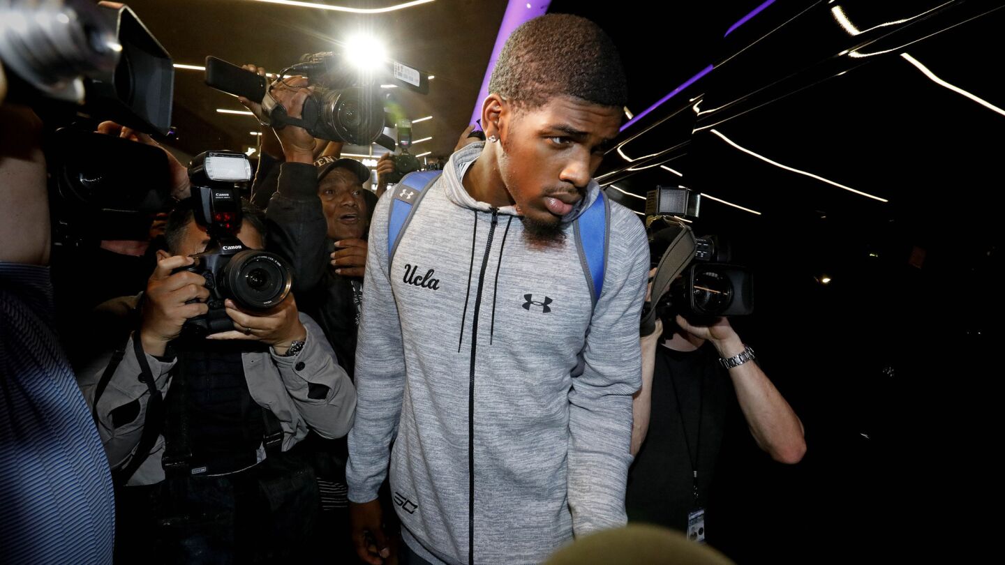 UCLA freshman basketball player Cody Riley leaves Los Angeles International Airport after being held in China for a week on shoplifting charges.
