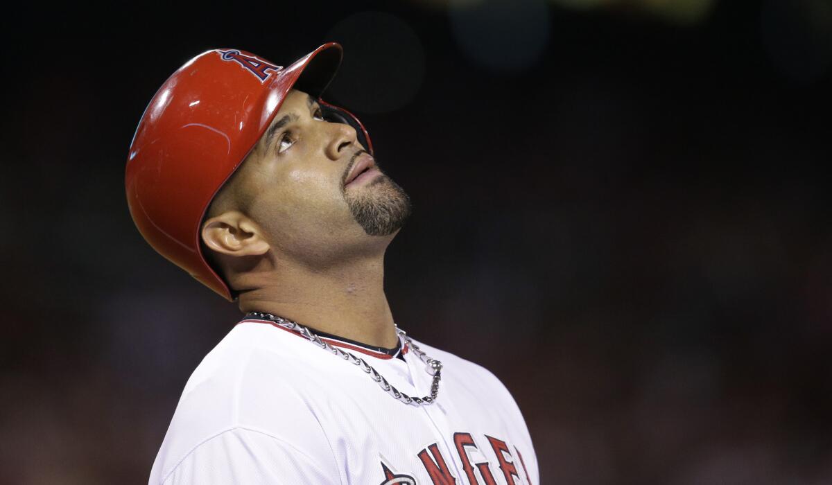 Angels first baseman Albert Pujols reacts after he grounded out in the fifth inning of the game against the Royals on Saturday night.