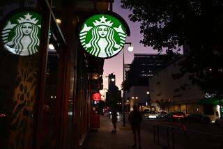 People stand outside a Starbucks closed for the day in Los Angeles, California on July 12, 2022. - Starbucks will close six locations in Los Angeles, including this one in downtown, by the end of the month. Company officials cite safety concerns for workers and customers as issues facing the nation, from racism to lack of access to health care to a growing mental health crisis, impact the coffee chain. (Photo by Frederic J. BROWN / AFP) (Photo by FREDERIC J. BROWN/AFP via Getty Images)