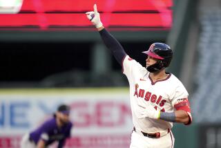 Los Angeles Angels' Logan O'Hoppe celebrates while running the bases after hitting a home run during the fourth inning of a baseball game against the Colorado Rockies in Anaheim, Calif., Thursday, Aug. 1, 2024. (AP Photo/Eric Thayer)