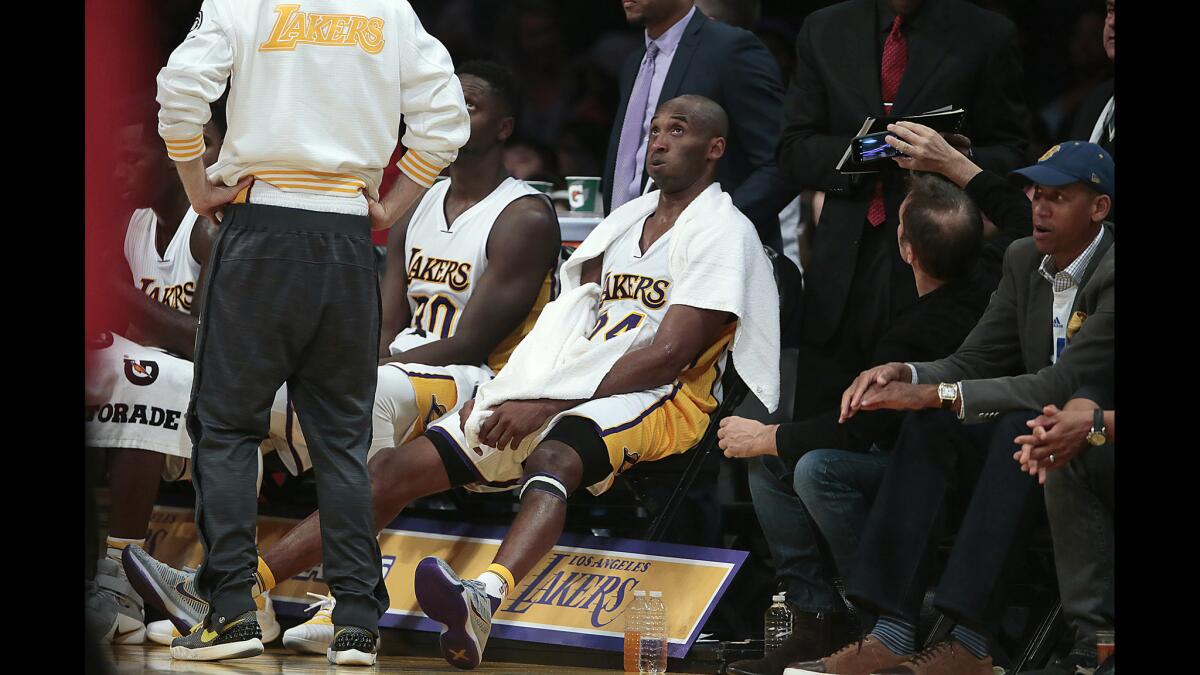 Lakers guard Kobe Bryant looks to catch his breath during a timeout late in a game against the Indiana Pacers at Staples Center on Nov. 29.