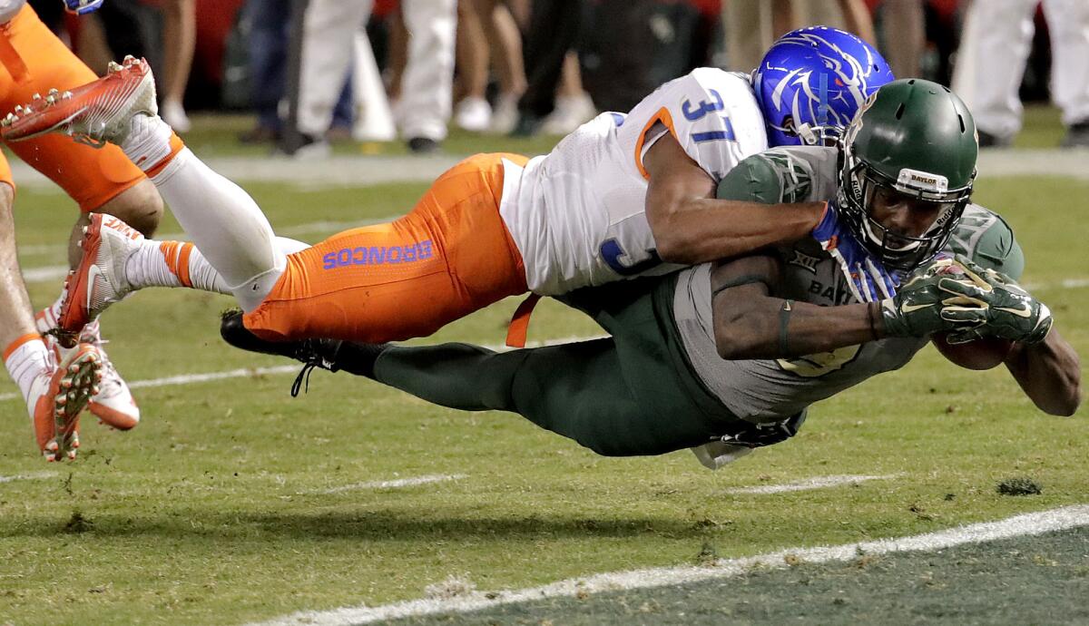 Baylor wide receiver Ishmael Zamora beats Boise State safety Cameron Hartsfield (37) to the goal line to score a touchdown during the second half Tuesday night in Cactus Bowl.