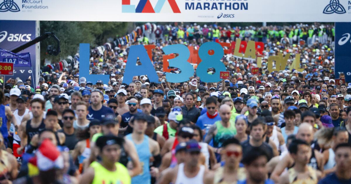 Undeterred by weather runners take to the streets for the 38th L.A. Marathon