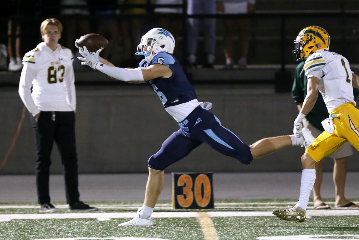 Corona del Mar's John Humphreys, shown stretching out for a catch against Edison on Oct. 11, leads Orange County receivers with 23 touchdown receptions this season.