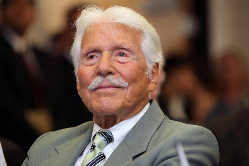 At the age of 90, Efrem Zimbalist Jr. watches during a ceremony honoring him at the FBI building in Los Angeles in 2009.