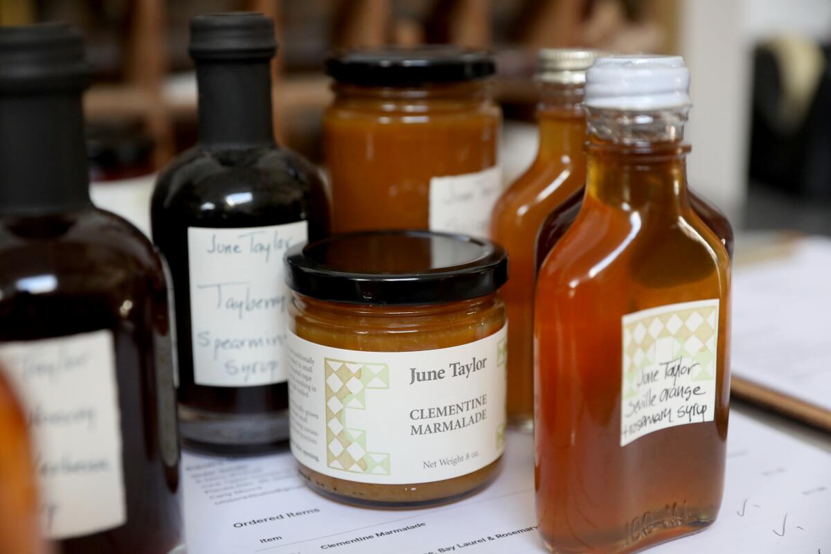 Bottles and jars of marmalade and syrups from the June Taylor Company.