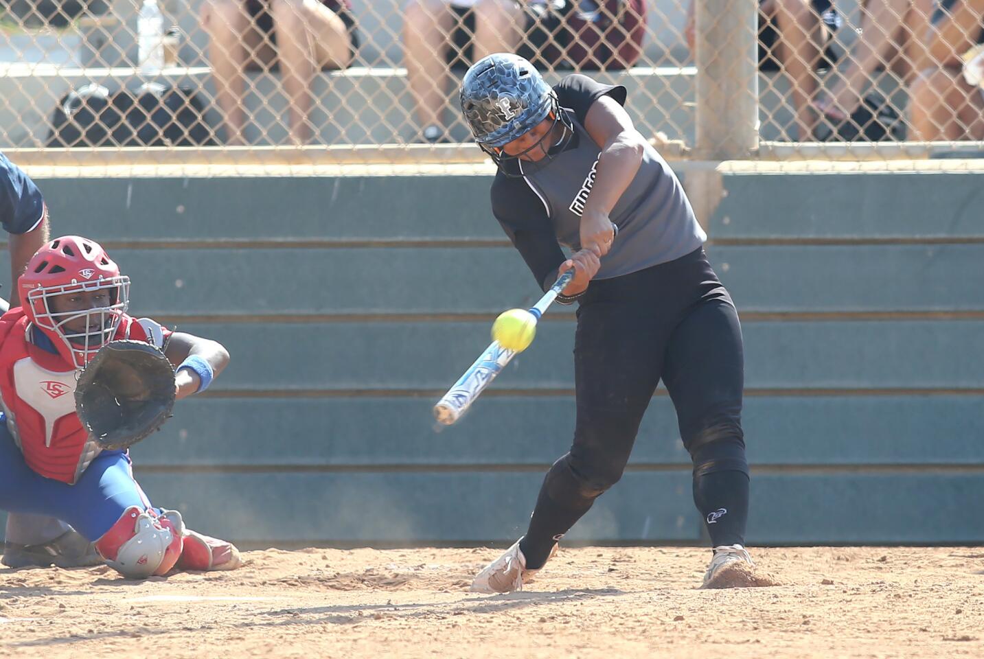 Firecracker's Laylo Melendez hits a home run to tie the score 2-2 during 16U Premier softball game of the PGF Nationals at Fountain Valley Sports Park on Thursday.