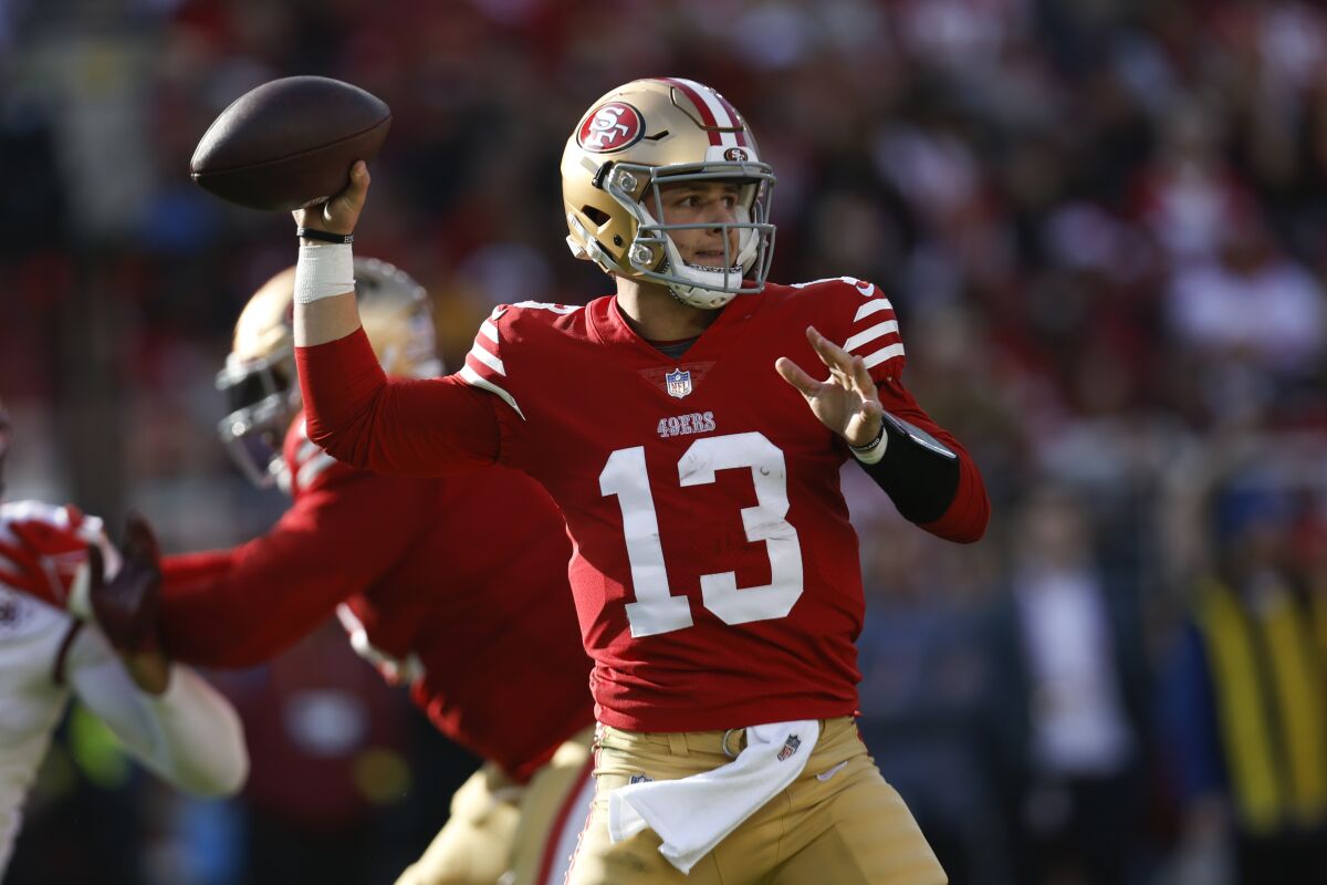San Francisco 49ers quarterback Brock Purdy readies to throw a pass.