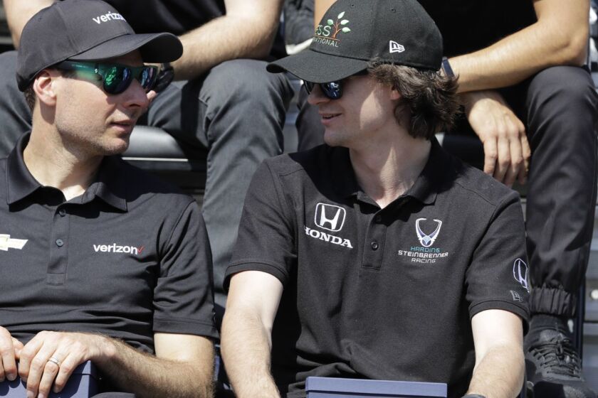 Will Power, of Australia, left, talks with Colton Herta during the drivers meeting for the Indianapolis 500 IndyCar auto race at Indianapolis Motor Speedway, Saturday, May 25, 2019, in Indianapolis. (AP Photo/Darron Cummings)