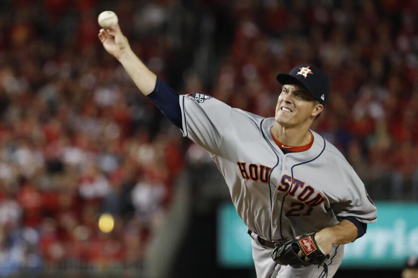 Houston Astros starting pitcher Zack Greinke throws against the Washington Nationals during the first inning of Game 3 of the baseball World Series Friday, Oct. 25, 2019, in Washington. (AP Photo/Jeff Roberson)
