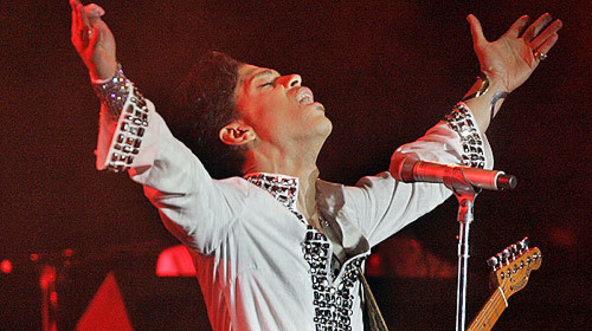 Prince exults in the cheers from the Coachella crowd in 2008.