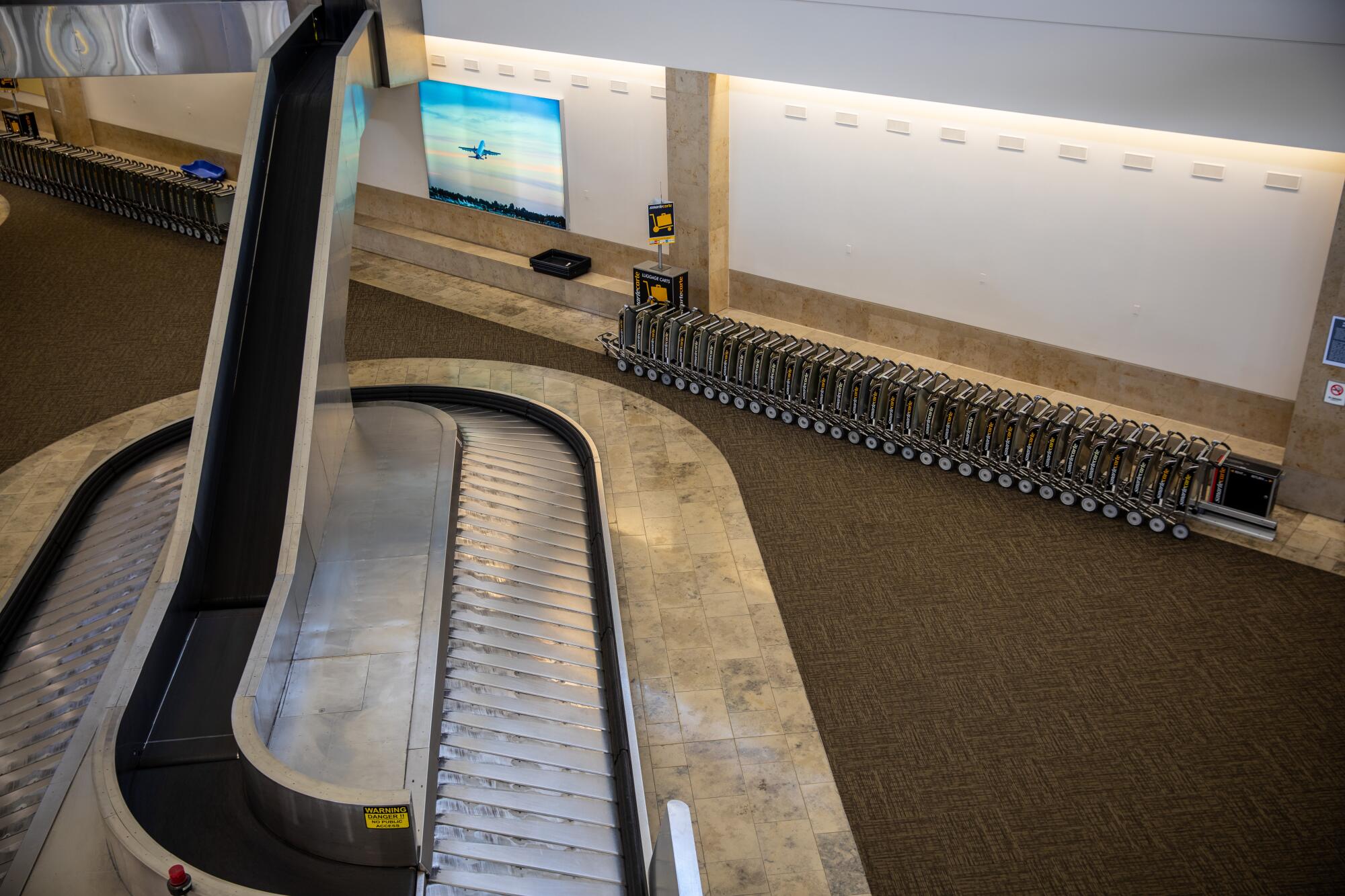 Empty baggage carousel at John Wayne Airport in Santa Ana