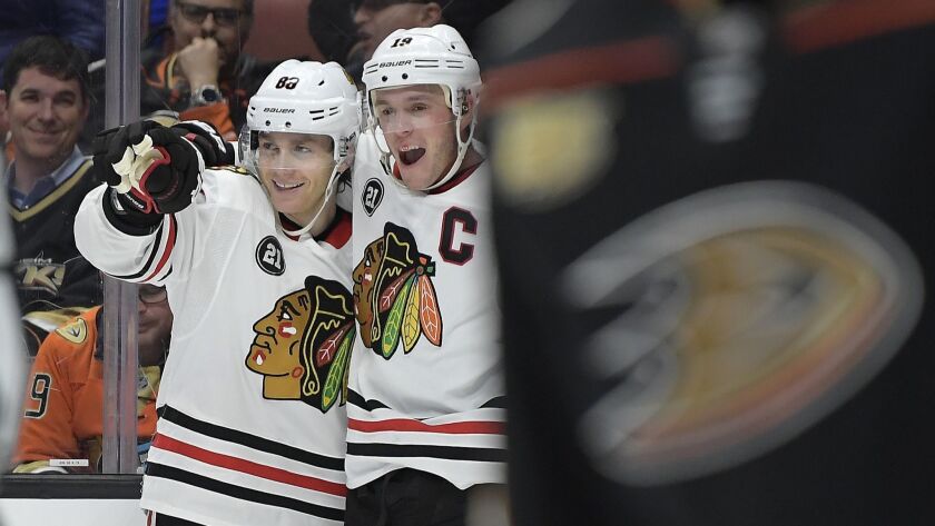 Blackhawks right wing Patrick Kane, left, celebrates with teammate Jonathan Toews after scoring the go-ahead goal with 16 seconds remaining to lift Chicago to a 4-3 win over the Ducks on Wednesday.