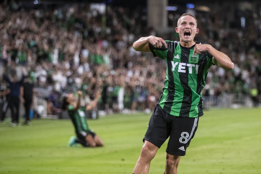 FILE - Austin FC midfielder Alexander Ring (8) celebrates after scoring against the Portland Timbers during an MLS soccer match Thursday, July 1, 2021, in Austin, Texas. Veteran defender and club captain Alex Ring has agreed to a new, multi-year contract with MLS team Austin that also makes him one of the club's designated players. Ring's contract includes guarantees for 2022 and 2023 with options for the following two years, the club announced Monday, Jan. 3, 2021. (Ricardo B. Brazziell/Austin American-Statesman via AP, File)