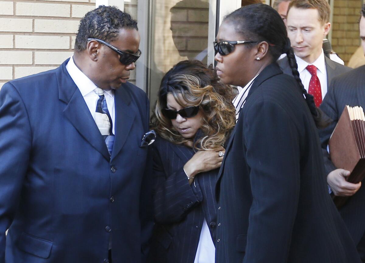 Tyka Nelson, center, is Prince's only full sibling. (Jim Mone / Associated Press)