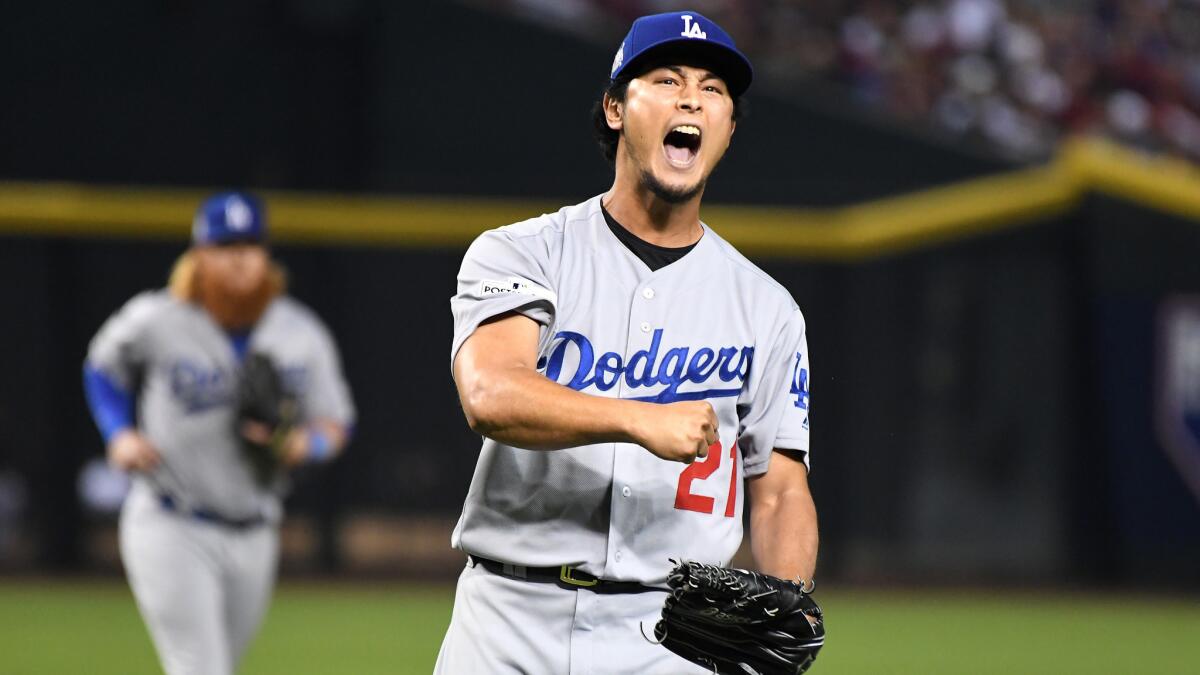 Dodgers starting pitcher Yu Darvish reacts after striking out a Diamondbacks batter to end the fourth inning in Game 3 of the NLDS on Oct. 9.