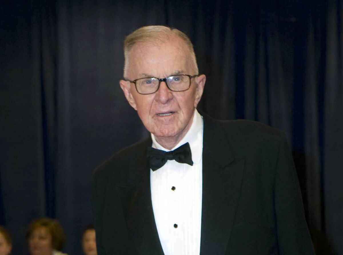 John McLaughlin, host of "The McLaughlin Group," arrives at the White House Correspondents' Association dinner in Washington in 2012.