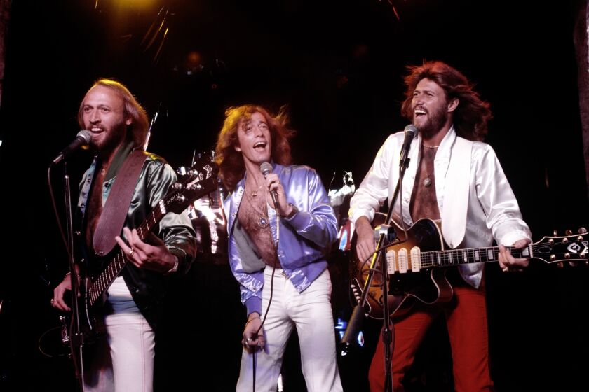 Maurice (left), Robin and Barry Gibb of the Bee Gees, performing in 1979. The group is the subject of "The Bee Gees: How Can You Mend a Broken Heart," a new documentary airing on Dec. 12 on HBO.