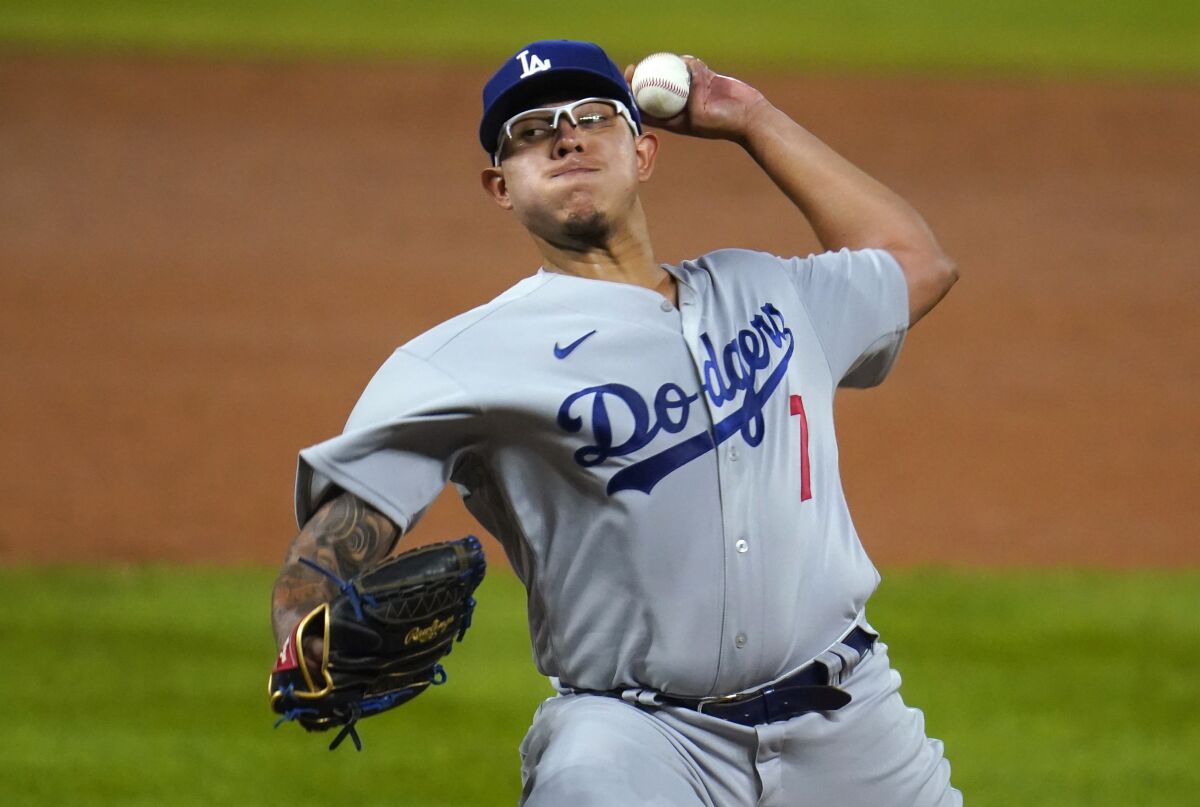 Dodgers starting pitcher Julio Urias delivers during the third inning of a 9-3 win over the Colorado Rockies.