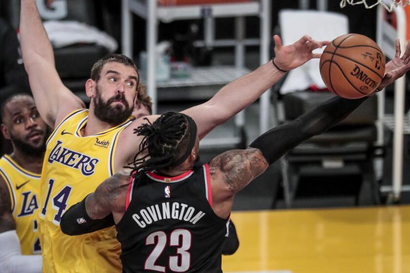 Los Angeles, CA, Monday, December 28, 2020 - Los Angeles Lakers center Marc Gasol (14) blocks the shot of Portland Trail Blazers forward Robert Covington (23) during second half action at Staples Center. (Robert Gauthier/ Los Angeles Times)