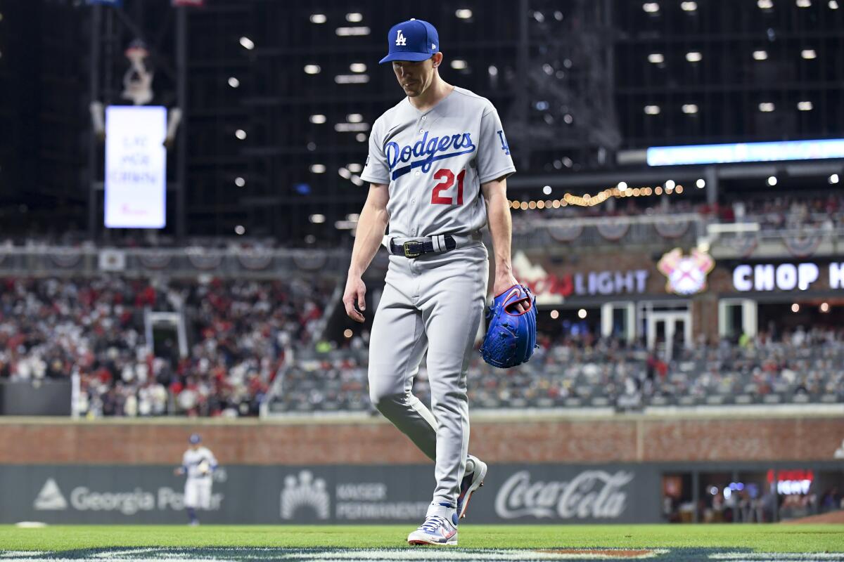 Dodgers starting pitcher Walker Buehler leaves the field during the fourth inning.