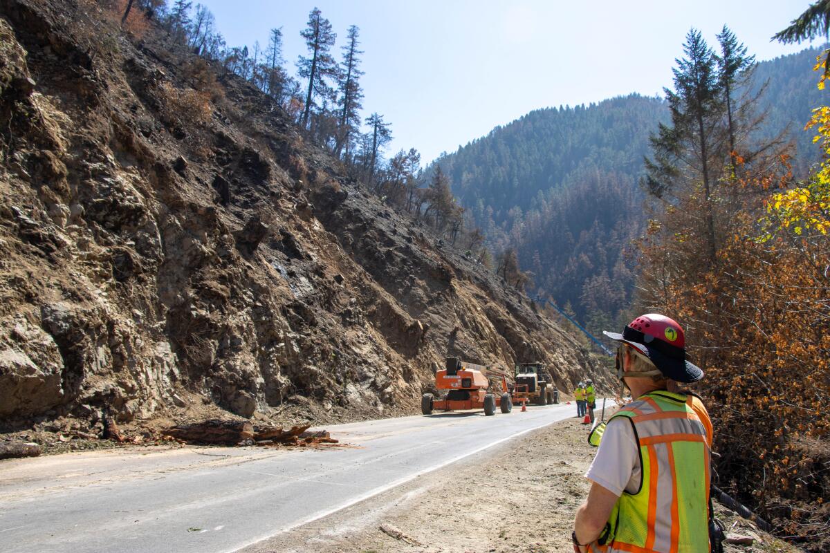 CalTrans crews working on a section of Highway 199 where rocks and debris fell from a hill