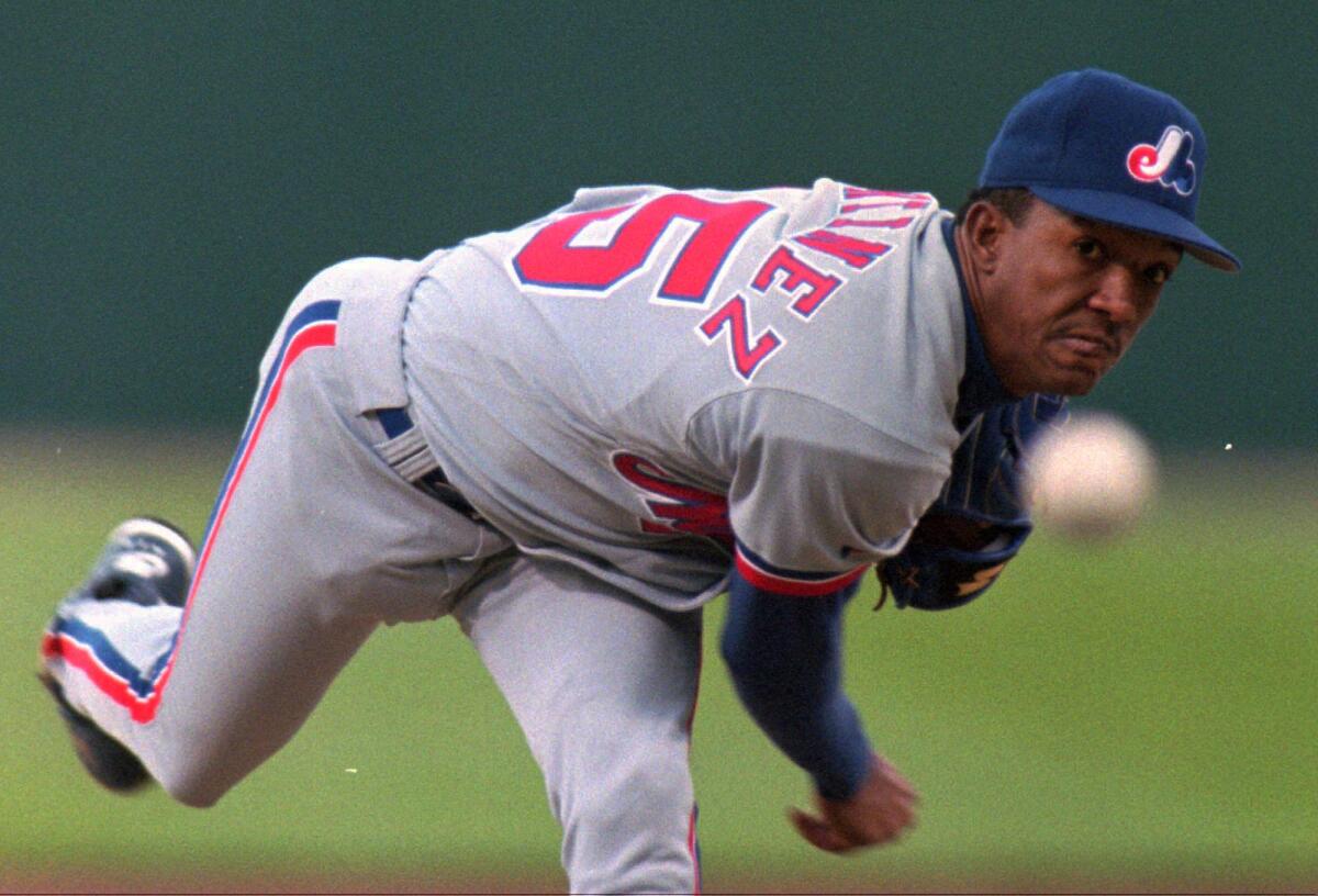 Former Montreal Expos pitcher Pedro Martinez, left, and outfielder