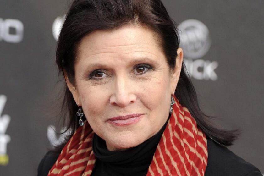 FILE - This April 7, 2011 file photo shows Carrie Fisher at the 2011 NewNowNext Awards in Los Angeles. A coroner's report released Monday, June 19, 2017, shows that Fisher had cocaine, ecstasy and heroin in her system when she became ill on a London to Los Angeles flight in December. The reports states it is difficult to pinpoint when the drugs were taken and their impact on Fisher's Dec. 27, 2016 death, which was caused by sleep apnea and other undetermined factors, Fisher's autopsy report states. (AP Photo/Chris Pizzello, File)